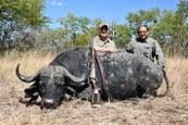 Happy buffalo hunter with his trophy in Zambia