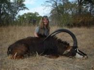 Huntress with trophy sable in Zambia