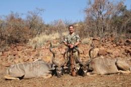 Hunter with 2 kudus