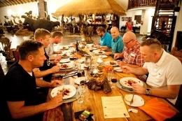 Clients eating dinner at 5-star lodge