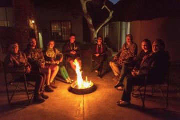 Hunters around Firepit at night