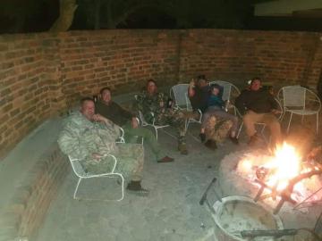 Hunters around fire at Free State Fire Pit